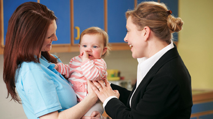 Working Mother Dropping Child At Nursery